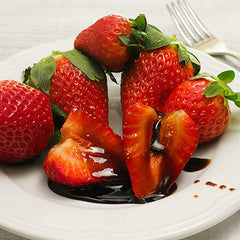 Sanniti Saba being drizzled over dessert adding sweet-acid balance and shine