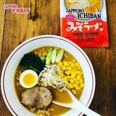 Bowl of Sapporo Ichiban miso ramen served with toppings, showcasing satisfying meal idea