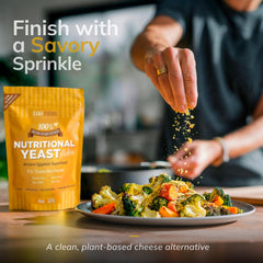 Sari Foods flakes sprinkled on pasta showing savory, cheesy flavor without dairy