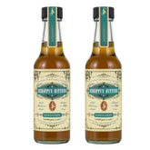 Scrappy's cardamom bitters front packaging showing label and two bottles for versatile use