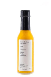 Señor Lechuga front bottle showing label and vibrant color, highlighting gourmet flavor
