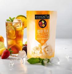 Shangri-La Tea Company pitcher of iced tea with ice and fruit garnish, ready-to-serve refreshment benefit