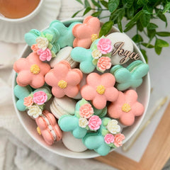 SIMPLY SUCRÉ small roses adorning frosted cupcake for instant elegant dessert presentation