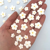 SIMPLY SUCRÉ front packaging showing 54 white royal icing blossoms and count benefit