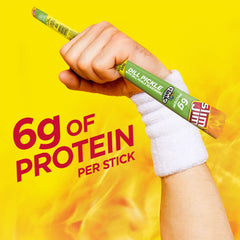 Hand holding Slim Jim stick to show size and satisfying handheld snack benefit