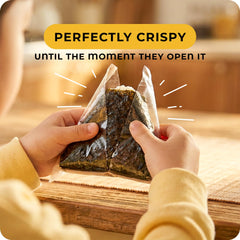 Snackathon wrapped triangle onigiri demonstrating neat hold and portability