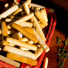 Snacktery mini breadsticks arranged with dips and cheese, ideal for entertaining and snacking
