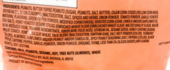 Southern Grove trail mix beside a measuring cup indicating portion size and portable convenience