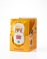 Spread The Love front packet showing single-serve convenience and organic claim