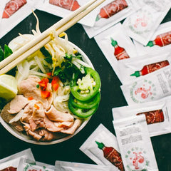 Sriracha2Go single packet closeup highlighting easy-tear convenience