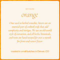 Hand-peeled orange zest beside bottle, Strongwater citrus oils for aroma