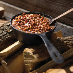 Pouring Stubb's into a bowl of marinade to boost barbecue taste