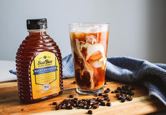 Sue Bee honey pouring into tea providing smooth natural sweetness