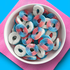 SweeTARTS open bag spilling Blue Punch and Strawberries & Cream halos, useful for party servings