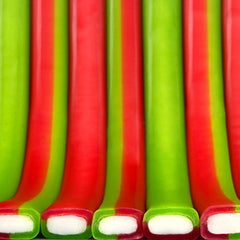 Close-up of SweeTARTS rope texture showing soft chewiness and vivid color contrast