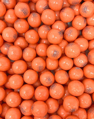 SweetGourmet gumballs in hand for scale showing convenient one-inch diameter