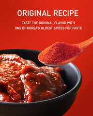 Taekyung spoon adding powder into gochujang paste for rich color