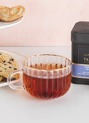 Taylors of Harrogate brewed cup in a teacup with lemon garnish, aromatic bergamot uplift