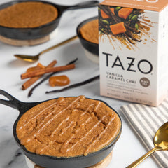 TAZO tea bag steeping in cup releasing warm chai aroma
