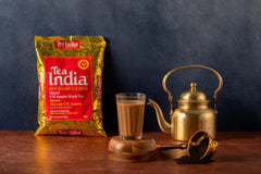 Tea India measured scoop on scale, illustrates precise portioning for consistent cups