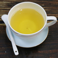 TEARELAE steeped tea cup with clear amber liquor and inviting aroma benefit