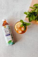 Teas' Tea poured into a glass over ice highlighting cool mint flavor and thirst-quenching benefit