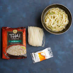 Thai Kitchen prepared spring onion noodle soup in bowl showing appetizing broth and garnish