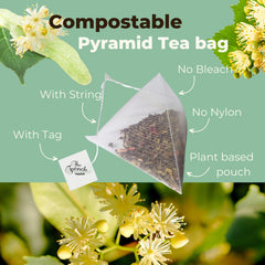 The French Touch pyramid bag steeping in a clear cup demonstrating full bloom and flavor release
