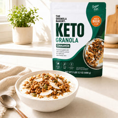 THE GRANOLA BAKERY poured over yogurt to show low-carb cereal topping benefit