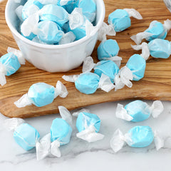 THE HAMPTON CANDY COMPANY blue taffy in a bowl at a party adding colorful visual appeal