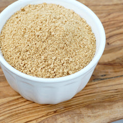 Crumbs sprinkled over ice cream by The Hampton Candy Company adding crunchy topping