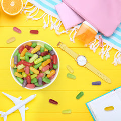 THE HAMPTON CANDY COMPANY bag next to a measuring cup for scale, demonstrates large 28.8 oz capacity