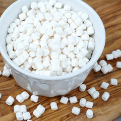 THE HAMPTON CANDY COMPANY scooping marshmallows into hot cocoa for easy topping
