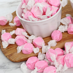 Party display bowl filled with The Hampton Candy Company strawberry taffy for event appeal