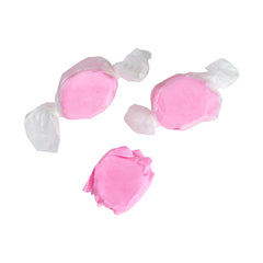 Texture detail of soft pink taffy by The Hampton Candy Company highlighting chewiness
