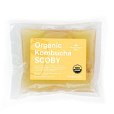 The Kombucha Shop front packaging showing organic SCOBY and starter liquid benefits convenience