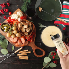 The Melting Pot seasoning pouring onto steak, brand adds savory finish and depth