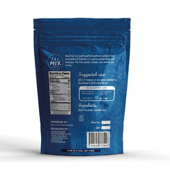 THE MIX SUPERFOODS scoop of fine monk fruit powder highlighting easy portioning benefit