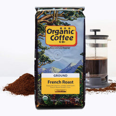 Steaming brewed cup beside The Organic Coffee Co. bag illustrating strong bold pour and satisfying aroma benefit