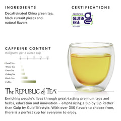 Steaming cup of brewed Wild Berry Plum tea in hand showing The Republic of Tea aroma and smoothness