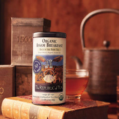 Close-up of The Republic of Tea Assam tea bag and tag, showing texture and quick steeping benefit