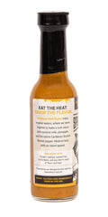 Close-up pour of Caribbean Reef Shark sauce highlighting creamy texture and balanced heat