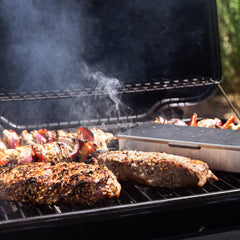 Thoughtfully seasonings sprinkled on grilled steak showing enhanced flavor appeal