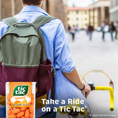 Tic Tac orange pack tucked in a jeans pocket illustrating portability and easy grab-and-go refreshment
