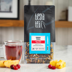 Tiesta Tea loose-leaf close-up revealing cherry, hibiscus, and rooibos texture for richer flavor