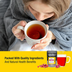Tiesta Tea steaming cup in hand conveying warm, caffeine-free comfort