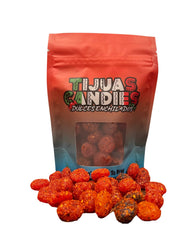 Tijuas Candies in a party bowl with guests enjoying them, adds festive appeal