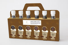 Tilz six 75ml bottles next to a coffee cup showing compact size and convenient gifting