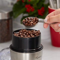Tim Hortons beans inside a burr grinder demonstrating fresh grind control and flavor