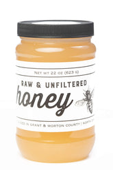 TJO Bees front jar view showing amber honey and clear packaging for quick identification